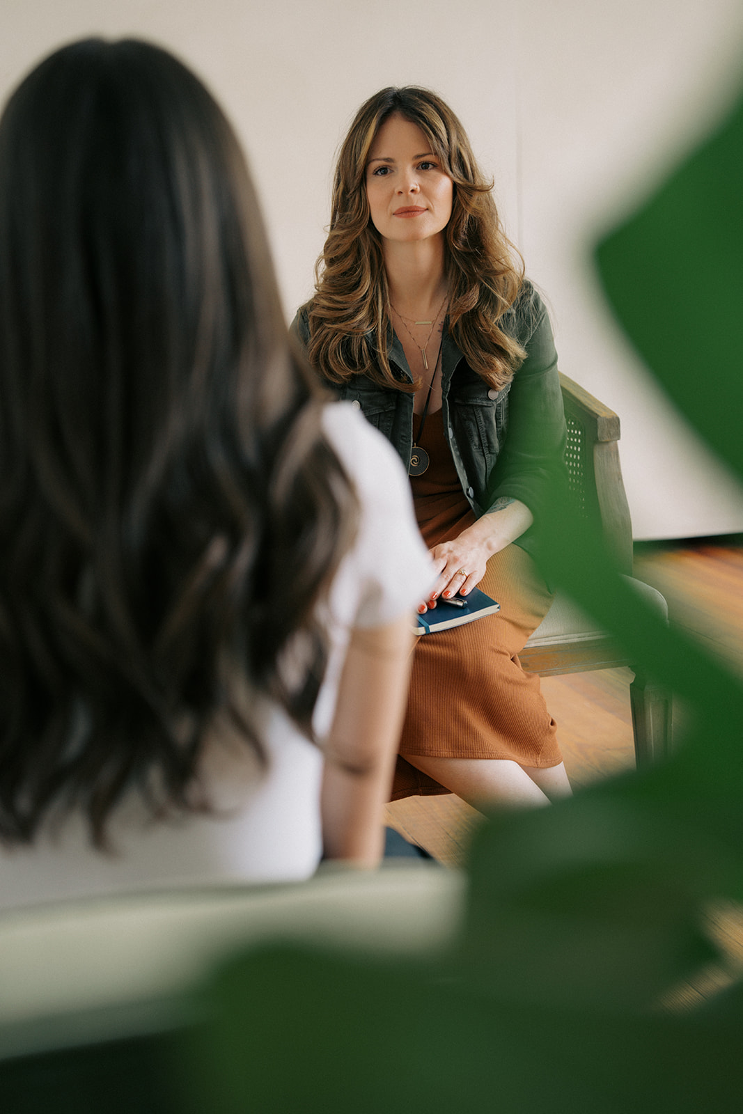 Trauma therapist listening to a client during a betrayal trauma therapy session in Houston, Texas.