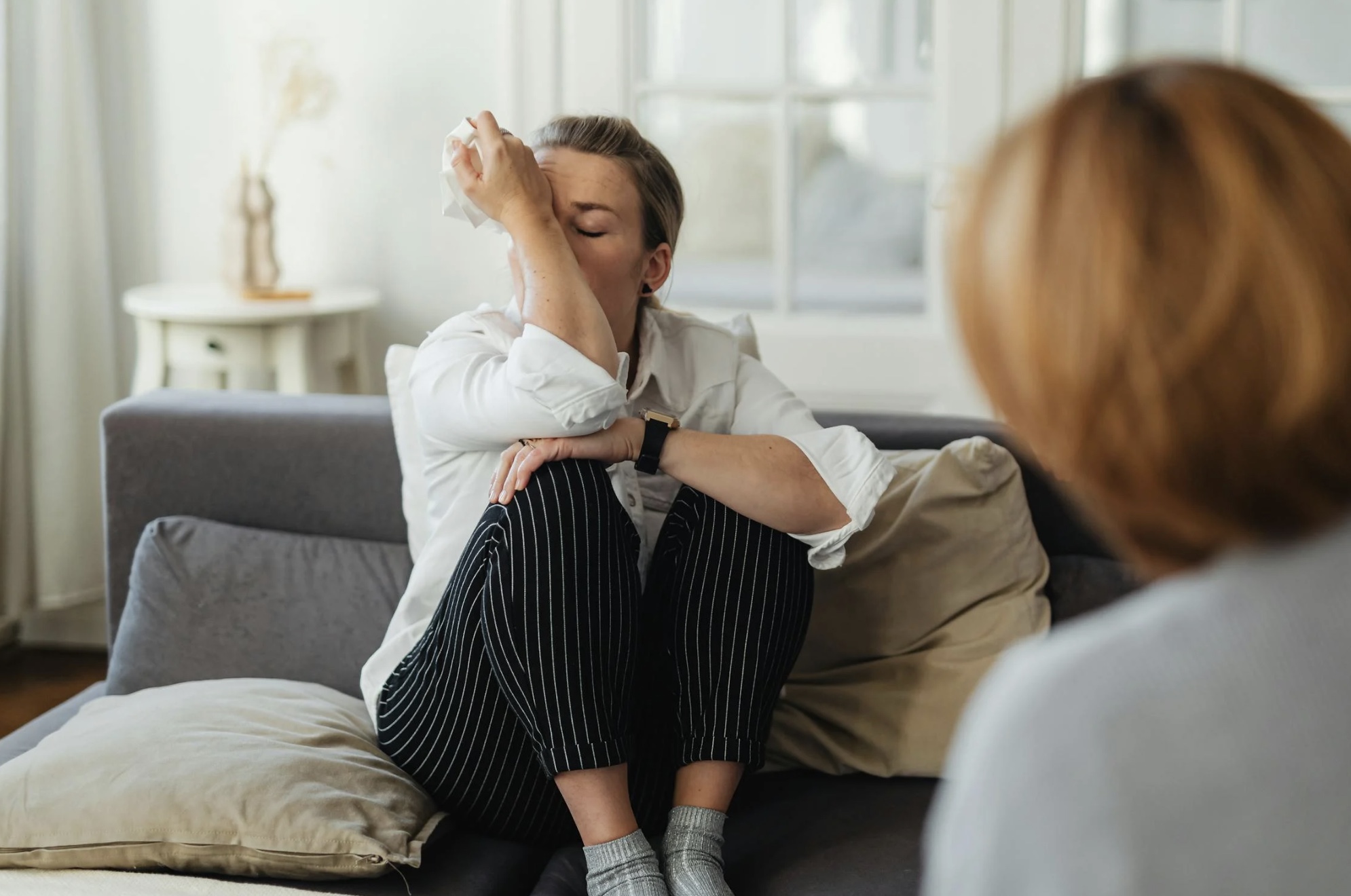 Woman in distress during an eating disorder therapy session in Houston