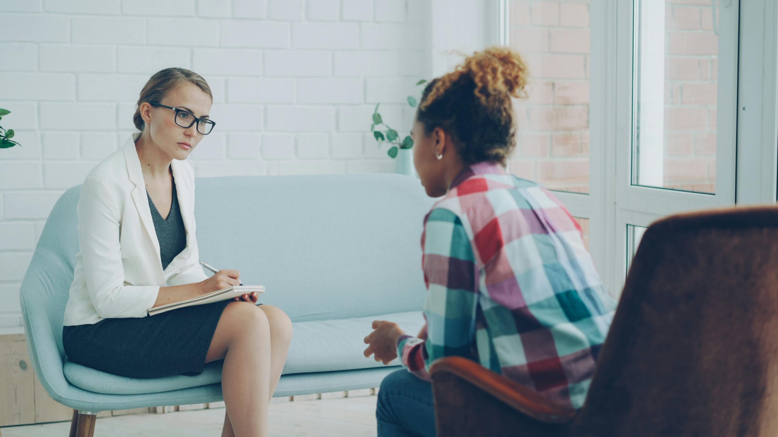 Woman speaking with a female body image therapist during a therapy session in Houston